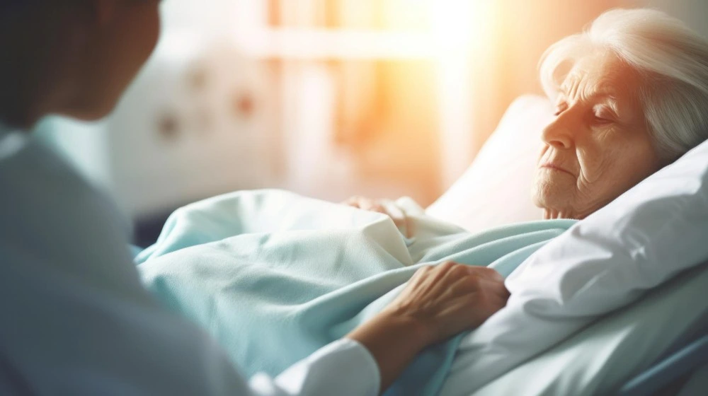 Caregiver supporting elderly patient