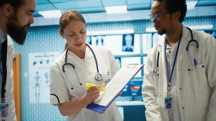 Doctors reviewing patient charts